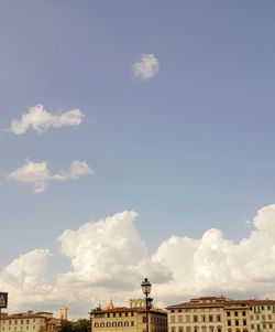 Low angle view of building against cloudy sky