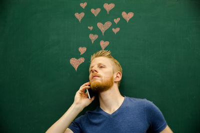 Portrait of young man looking at camera