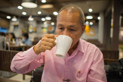 Close-up of a man drinking coffee