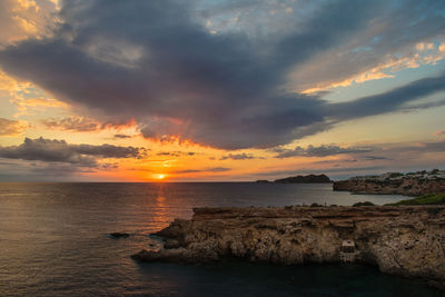 Ibiza, spain, october 23 2021, beautiful sunset near the stonege monument of ibiza at cala llentia