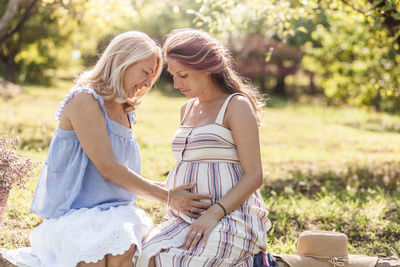 Rear view of couple kissing outdoors