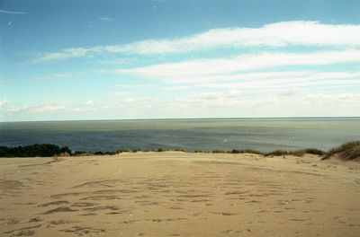 Scenic view of sea against cloudy sky