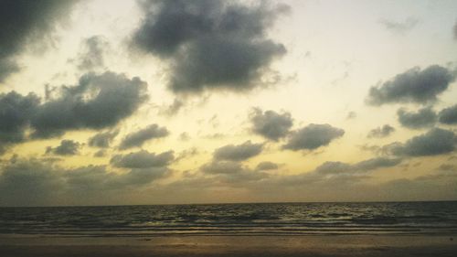 Scenic view of sea against cloudy sky