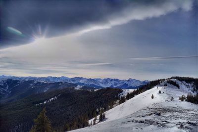 Sun shining over mountain