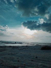 Scenic view of beach against sky during sunset