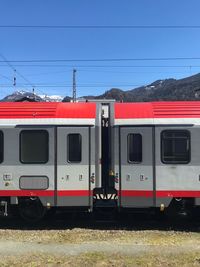 Train on railroad tracks against sky