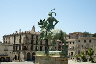 Low angle view of statue against sky