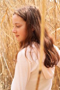 Side view of young woman looking away