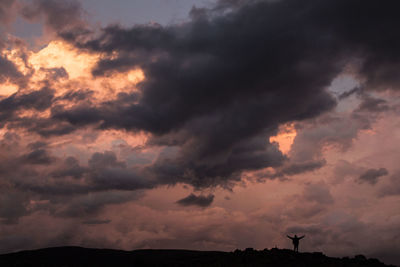 Low angle view of cloudy sky during sunset