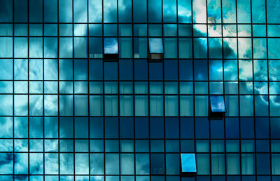 Reflection of clouds on glass building