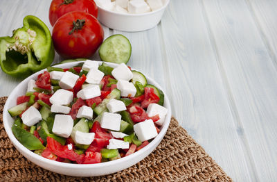 Bulgarian shopska type salad with tomato, cucumber, peppers and feta cheese