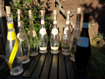 Glass of bottles on table