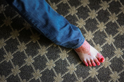 Low section of woman wearing canvas shoes