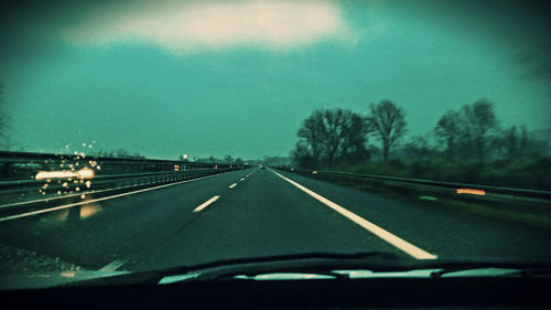 Road passing through car windshield