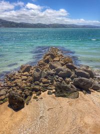 Scenic view of sea against cloudy sky