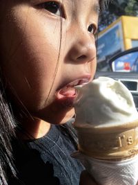 Close-up portrait of a boy drinking ice cream