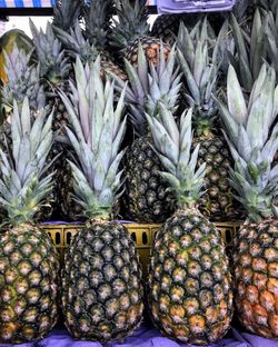 Full frame shot of pineapple fruits for sale in market