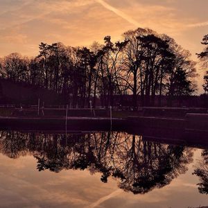 Scenic view of lake at sunset