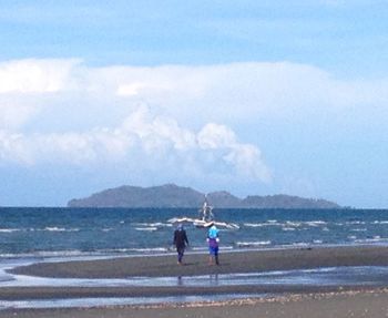 Scenic view of sea against cloudy sky