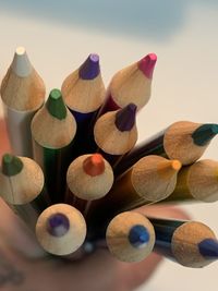 Close-up of multi colored pencils on table