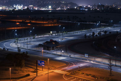 High angle view of light trails on road at night