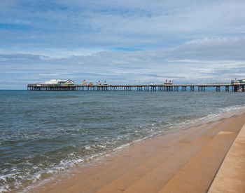 Pier over sea against sky