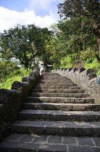 Steps leading to stairs against sky