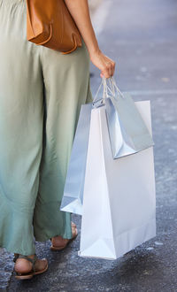 Low section of woman with umbrella