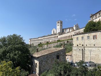 Low angle view of historic building against blue sky