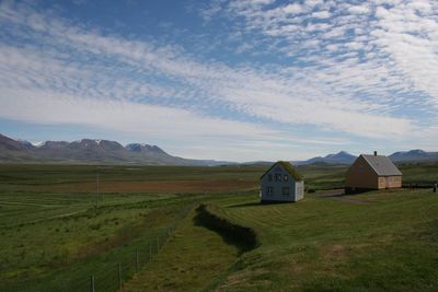 House on field against sky