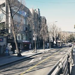 View of street and buildings against sky