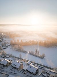 High angle view of snow covered landscape against sky
