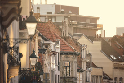 Low angle view of buildings in etterbeek, bruxelles d'urine golden hour