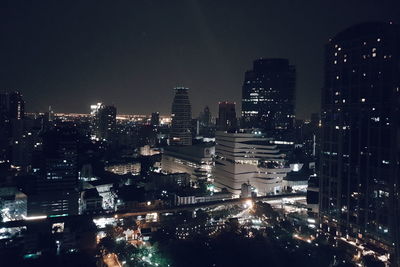 High angle view of illuminated buildings in city at night