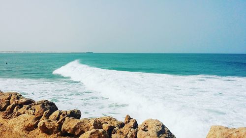 Panoramic view of sea against clear sky