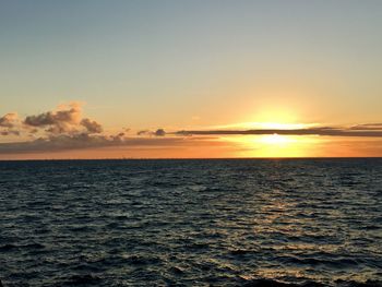 Scenic view of sea against clear sky during sunset