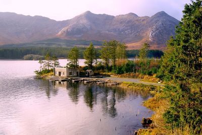 Scenic view of lake with mountains in background