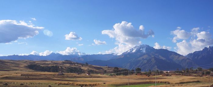 Scenic view of mountains against cloudy sky