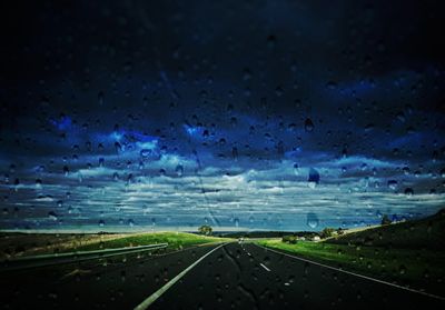 Road against sky at night