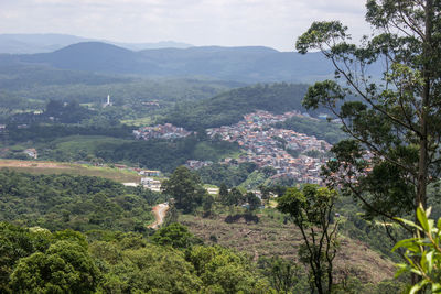 High angle view of trees and mountains against sky