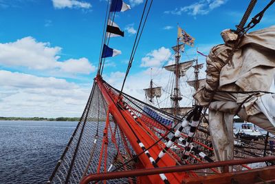 Low angle view of ship sailing against sky