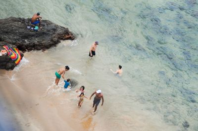 High angle view of people playing on beach