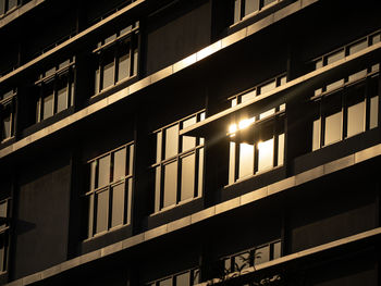 Low angle view of illuminated building at night