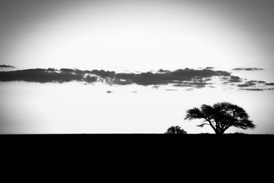 Scenic view of silhouette landscape against sky at dusk