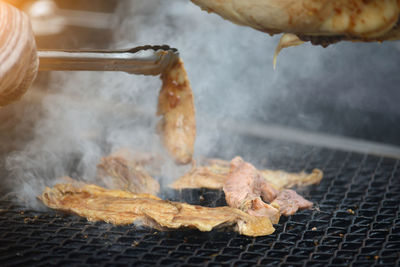 Close-up of meat on barbecue grill