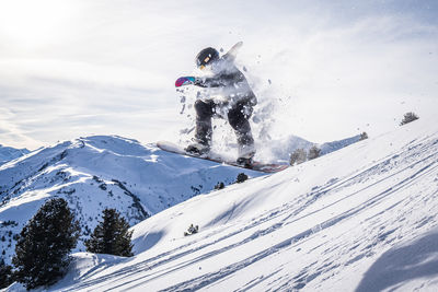 Man skiing on snowcapped mountain