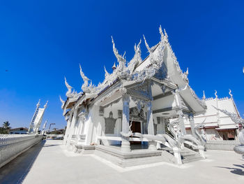 Low angle view of building against clear blue sky