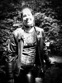 Portrait of smiling young man standing outdoors