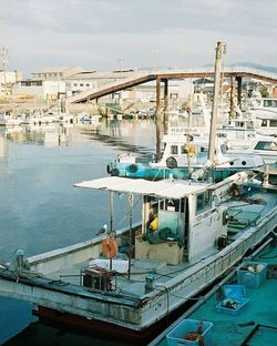 Boats moored at harbor