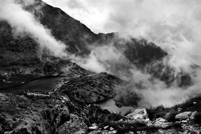 Scenic view of waterfall against sky